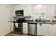 Contemporary kitchen featuring stainless steel appliances and granite countertops at 1310 Kings Cove Ct, Indianapolis, IN 46260