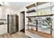 Functional kitchen with stainless steel refrigerator and open shelving at 1310 Kings Cove Ct, Indianapolis, IN 46260