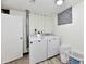 Well-lit laundry room featuring a modern washer and dryer set at 1310 Kings Cove Ct, Indianapolis, IN 46260