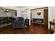 Open-concept living room with dark hardwood floors and a view of the dining area at 1310 Kings Cove Ct, Indianapolis, IN 46260