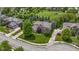 Aerial view showcasing brick house within a lush, green neighborhood and landscaped yard at 14094 Pecos Ct, Carmel, IN 46033