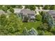 Aerial view of a home with expansive lawn, mature landscaping, and a charming screened porch and deck at 14094 Pecos Ct, Carmel, IN 46033