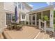 Charming back deck area featuring a metal table with an umbrella and seating with cushions, perfect for outdoor relaxation at 14094 Pecos Ct, Carmel, IN 46033