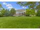 Expansive backyard with a well-maintained lawn, a screened porch, and a patio perfect for outdoor enjoyment at 14094 Pecos Ct, Carmel, IN 46033