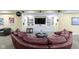Finished basement features a comfortable seating area, custom built-ins, and a large television for entertainment at 14094 Pecos Ct, Carmel, IN 46033