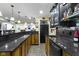 Stylish basement bar with granite countertops, sink, and plenty of storage space at 14094 Pecos Ct, Carmel, IN 46033