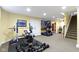 Finished basement features a home gym with workout equipment, and carpeted floors at 14094 Pecos Ct, Carmel, IN 46033