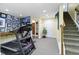 Finished basement features a treadmill, carpeted floors, and Gathering photos at 14094 Pecos Ct, Carmel, IN 46033
