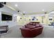 Finished basement featuring a large sectional sofa and custom shelving at 14094 Pecos Ct, Carmel, IN 46033