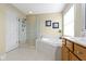 Bright bathroom features a separate shower, soaking tub and double sink vanity with lots of counter space at 14094 Pecos Ct, Carmel, IN 46033