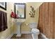 Bathroom featuring a pedestal sink, decorative branch, and patterned rust-colored shower curtain at 14094 Pecos Ct, Carmel, IN 46033