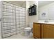 Cozy bathroom with a toilet, vanity with mirror, and shower with curtain at 14094 Pecos Ct, Carmel, IN 46033