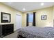 Cozy bedroom with a zebra-patterned bedspread, dark wood furniture, and neutral walls at 14094 Pecos Ct, Carmel, IN 46033