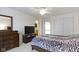 Bright bedroom with furniture, a ceiling fan, a TV, and a view of the doorway to the bathroom at 14094 Pecos Ct, Carmel, IN 46033