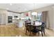 Bright, open kitchen with stainless steel appliances, a breakfast bar, and an adjacent dining area at 14094 Pecos Ct, Carmel, IN 46033
