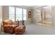 Bright living room featuring a comfortable seating arrangement, natural light, and elegant design at 14094 Pecos Ct, Carmel, IN 46033