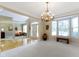 Spacious living room showcasing hardwood floors, a chandelier, and an entryway providing an open feel at 14094 Pecos Ct, Carmel, IN 46033