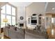 This spacious living room boasts a fireplace, built-in shelving, and oversized windows at 14094 Pecos Ct, Carmel, IN 46033
