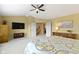 Comfortable main bedroom offers a ceiling fan, natural light, and plush carpeting at 14094 Pecos Ct, Carmel, IN 46033