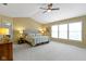 Spacious main bedroom offers vaulted ceilings, natural light, and plush carpeting at 14094 Pecos Ct, Carmel, IN 46033