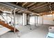 Spacious unfinished basement with laundry area and exposed beams ready for your personal touch and customization at 1431 N Bolton Ave, Indianapolis, IN 46219