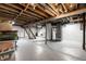 Spacious basement with exposed ceiling, and stairs at 1431 N Bolton Ave, Indianapolis, IN 46219