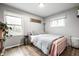 Bright bedroom with lots of natural light, wood floors, and neutral walls at 1431 N Bolton Ave, Indianapolis, IN 46219