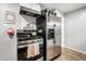 Cozy kitchen featuring stainless steel appliances and modern cabinetry providing a functional and stylish cooking space at 1431 N Bolton Ave, Indianapolis, IN 46219