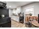 Functional kitchen featuring white cabinetry, modern appliances, and a cozy dining nook at 1431 N Bolton Ave, Indianapolis, IN 46219