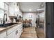 Efficient kitchen with white cabinets, a modern sink, and stainless steel appliances at 1431 N Bolton Ave, Indianapolis, IN 46219