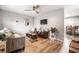 Bright living room showcasing wood-look floors, stylish seating, and modern entertainment setup at 1431 N Bolton Ave, Indianapolis, IN 46219
