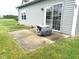 Concrete back patio adjacent to sliding glass doors and manicured lawn at 160 Rambling Rd, Greenfield, IN 46140