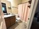 Cozy bathroom featuring neutral color palettes, built-in shelving, and a shower with a decorative curtain at 160 Rambling Rd, Greenfield, IN 46140