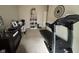 Bonus room with treadmill, desk, and shelving, perfect for exercise or home office at 160 Rambling Rd, Greenfield, IN 46140
