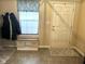 Welcoming entryway featuring a storage bench, neutral decor, and a practical space for coats and shoes at 160 Rambling Rd, Greenfield, IN 46140