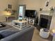 Inviting living space with a fireplace, entertainment center, and a comfortable sofa arrangement at 160 Rambling Rd, Greenfield, IN 46140