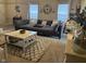 Spacious living room with a large sectional sofa, stylish coffee table, and bright natural light at 160 Rambling Rd, Greenfield, IN 46140