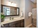 Well lit bathroom featuring a modern vanity with a framed mirror and a shower with stylish curtain at 1701 Summerwood Blvd, Greenfield, IN 46140