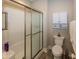 Bathroom featuring a shower, toilet, cabinet, and towel rack at 1701 Summerwood Blvd, Greenfield, IN 46140
