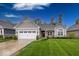 Charming home with a well-manicured lawn, two-car garage, and inviting front porch area at 1701 Summerwood Blvd, Greenfield, IN 46140