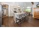 Bright kitchen with an island, stainless appliances, and views into the dining room at 1701 Summerwood Blvd, Greenfield, IN 46140