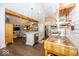 Open kitchen featuring an island and stainless appliances flowing into the living room at 1701 Summerwood Blvd, Greenfield, IN 46140