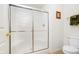 Bathroom featuring a glass shower enclosure, toilet, and wall-mounted towel rack at 194 Waterford Ct, Avon, IN 46123