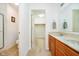Bathroom with double sinks, vanity, tile flooring, and view into the walk-in closet at 194 Waterford Ct, Avon, IN 46123