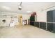 Spacious garage features ample storage space with custom cabinets and shelving at 194 Waterford Ct, Avon, IN 46123