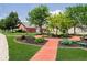 Professionally landscaped grounds with a brick pathway and lush gardens at 194 Waterford Ct, Avon, IN 46123