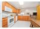 Bright kitchen featuring white appliances and plentiful counter space at 194 Waterford Ct, Avon, IN 46123