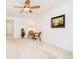Bright living room with a ceiling fan, neutral carpet, and table and chairs at 194 Waterford Ct, Avon, IN 46123