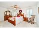 Spacious main bedroom featuring a ceiling fan, wood furniture, and natural light at 194 Waterford Ct, Avon, IN 46123