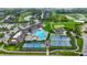 Aerial view showcases community pool, tennis courts, and golf course amenities, providing a luxurious lifestyle at 20010 Prescott Pl, Westfield, IN 46074